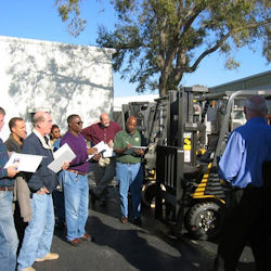 Outdoor forklift training for a group of employees