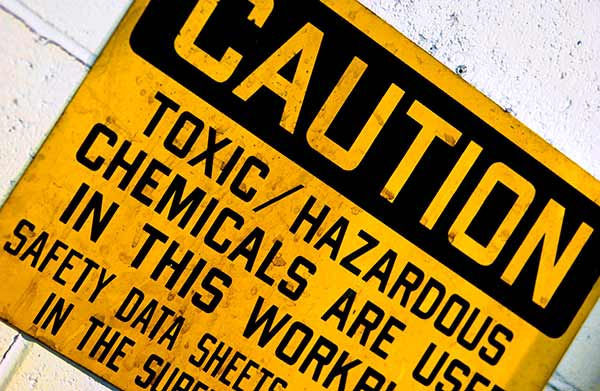 Caution sign showing toxic/hazardous chemicals