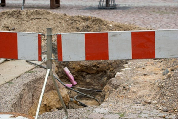 Trench covered by a barrier