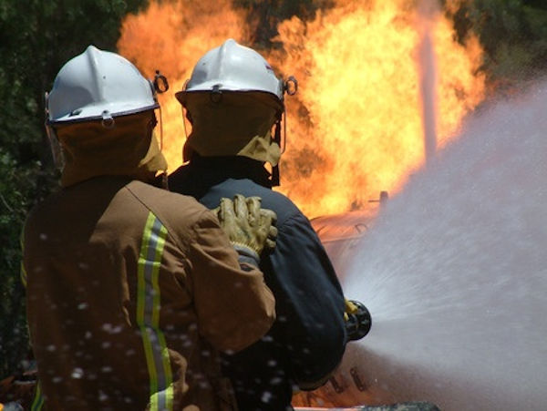 Firemen fighting building fire