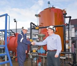 A worker and supervisor shaking hands