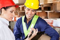 Employees reviewing a JHA job hazard analysis