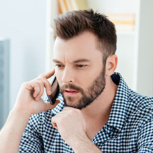Person sitting talking on phone