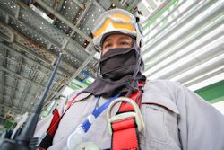 Worker outfitted with required PPE