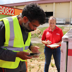 workplace inspector overseeing an employee