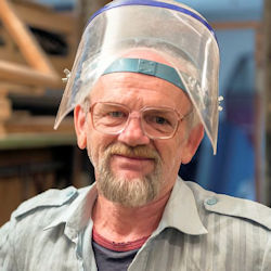 Worker wearing safety shield to protect entire face