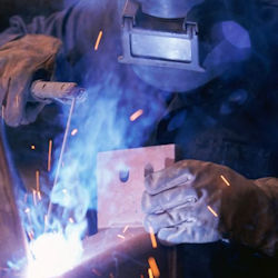 worker wearing a welding face shield