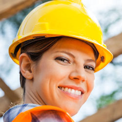 Worker wearing hard hat facing camera