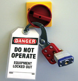 Lockout Tagout device with danger do not operate sign placed on switch