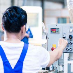 Employee verifying equipment has been shut down.
