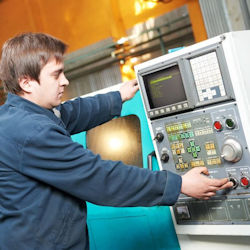 Employee restarting equipment.