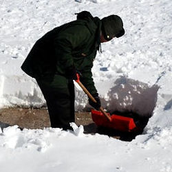Person shoveling snow.