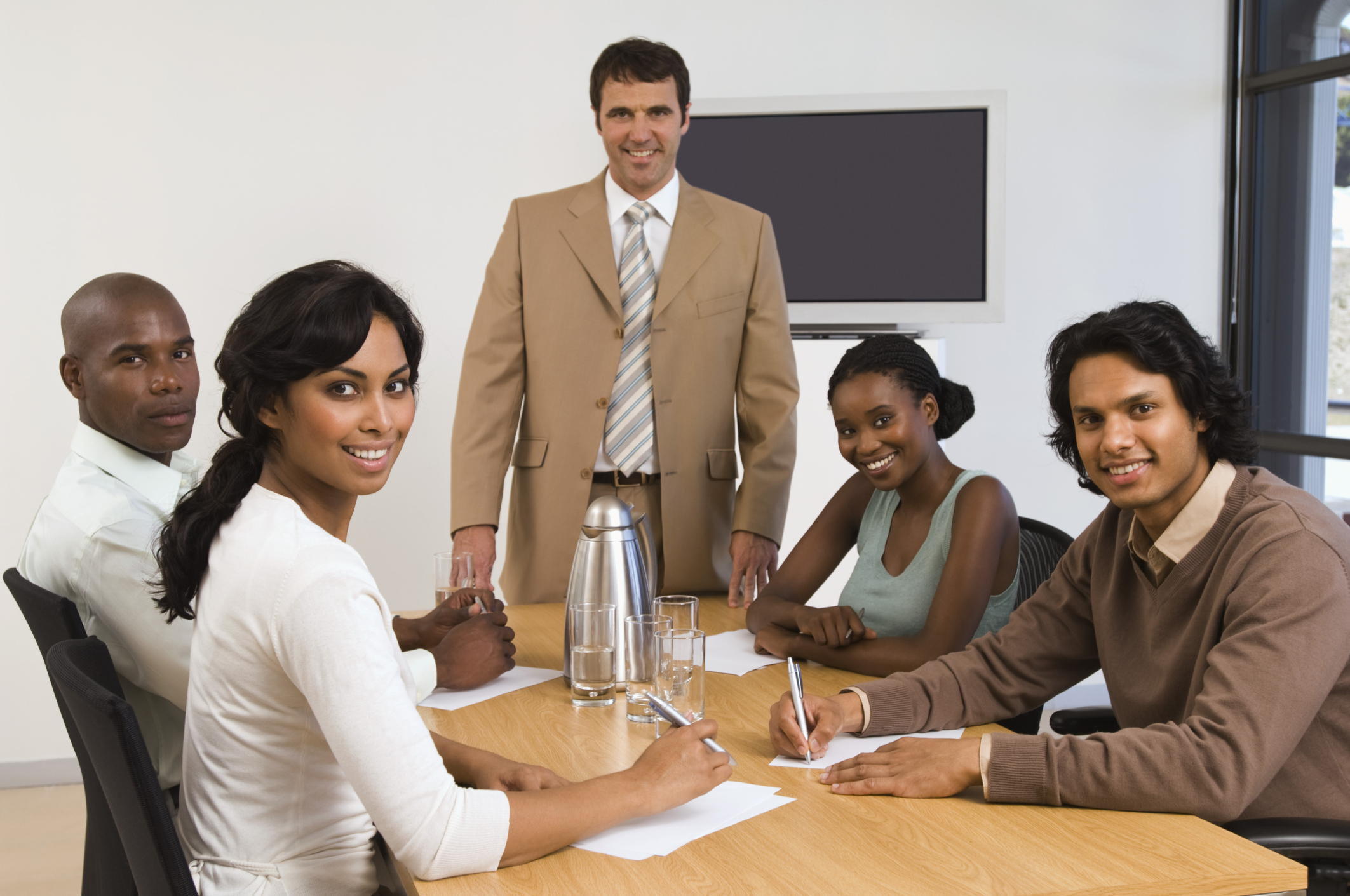 Image of safety team meeting around a table.