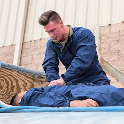 rescuer applying first aid