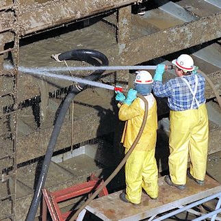 Two workers cleaning ourdoor structure