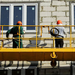 Two workers on a suspended scaffold
