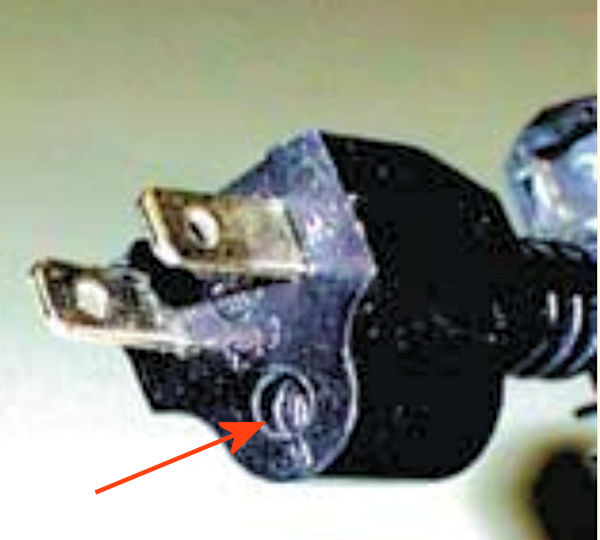 Dangerous three prong plug because it is missing a prong.