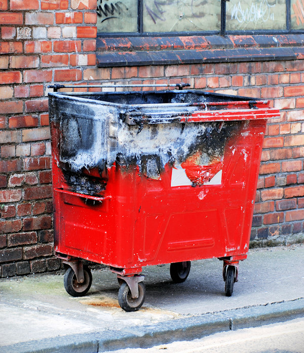 Outside dumpster damaged by fire