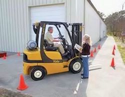 employee performing forlift performance test.