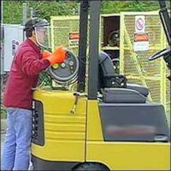 Worker refueling LPG forlift