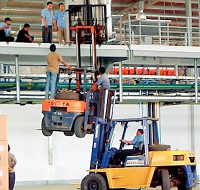 Don't ever do this a forklift lifting another forklift holding a standing employee