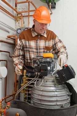 Image of worker inspecting and testing equipment.