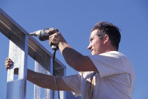 construction worker using a drill