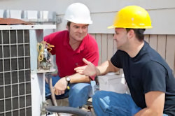 two workers discussing a hazard