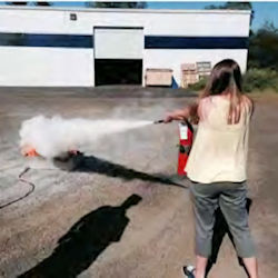 employee in fire extinguisher training