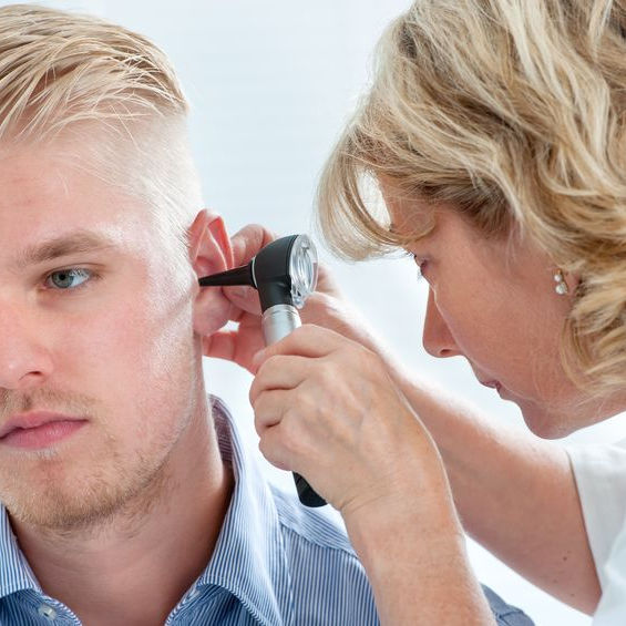 Patient receiving ear exam