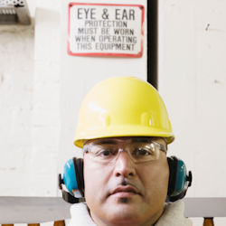 employee wearing eye and hearing protection