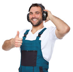 worker wearing hearing protection giving thumbs up