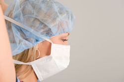 Worker putting on face shield