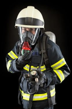 Worker in full SCBA Self-Contained Breathing Apparatus gear SCBA