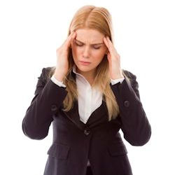 Image of Image of worker rubbing sides of head with headache.