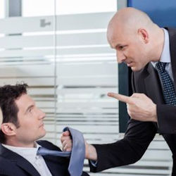 Angry worker threatening another worker