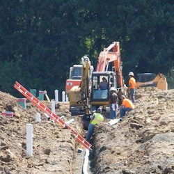 Excavation taking place after planning, inspections and training.