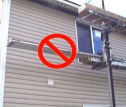 Planks extending too far over edge of scaffolding