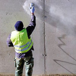 Worker outside using spray paint