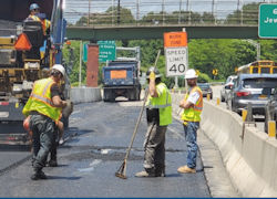 Traffic workzone protected from traffic by cement dividers