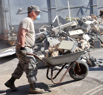 Worker cleaning up debris