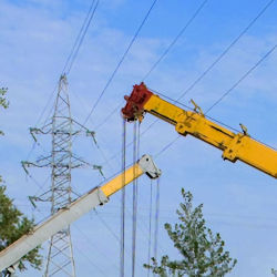 Cranes near power lines