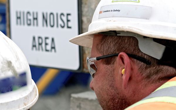 Construction worker with ear protection