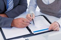 Image of employees reviewing silica exposures.