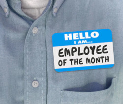employee wearing a employee of the month name tag