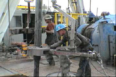 Workers on rig swinging out the kelly
