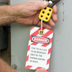 Worker installing a lockout device