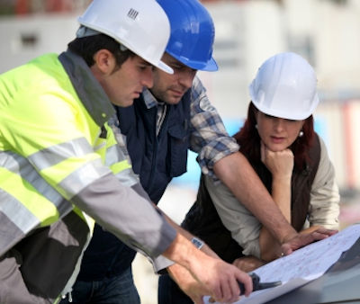 Workers reviewing the Health and Safety Plan
