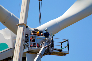 Image of employees working on a wind generator